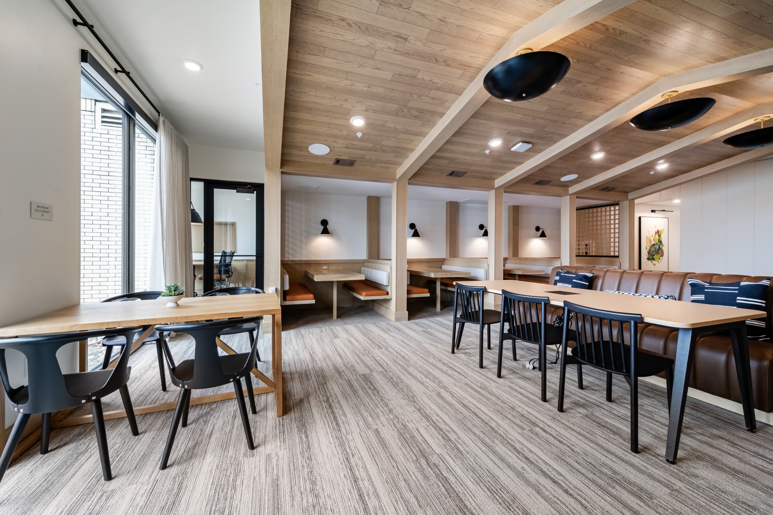 Coworking space with plenty of seating and private meeting rooms