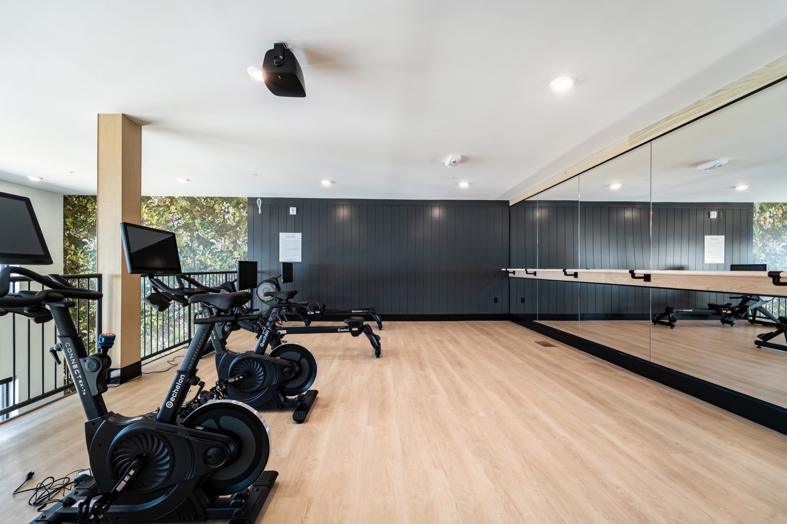 Fitness studio with spin bikes and barre at Banyan High Point scaled