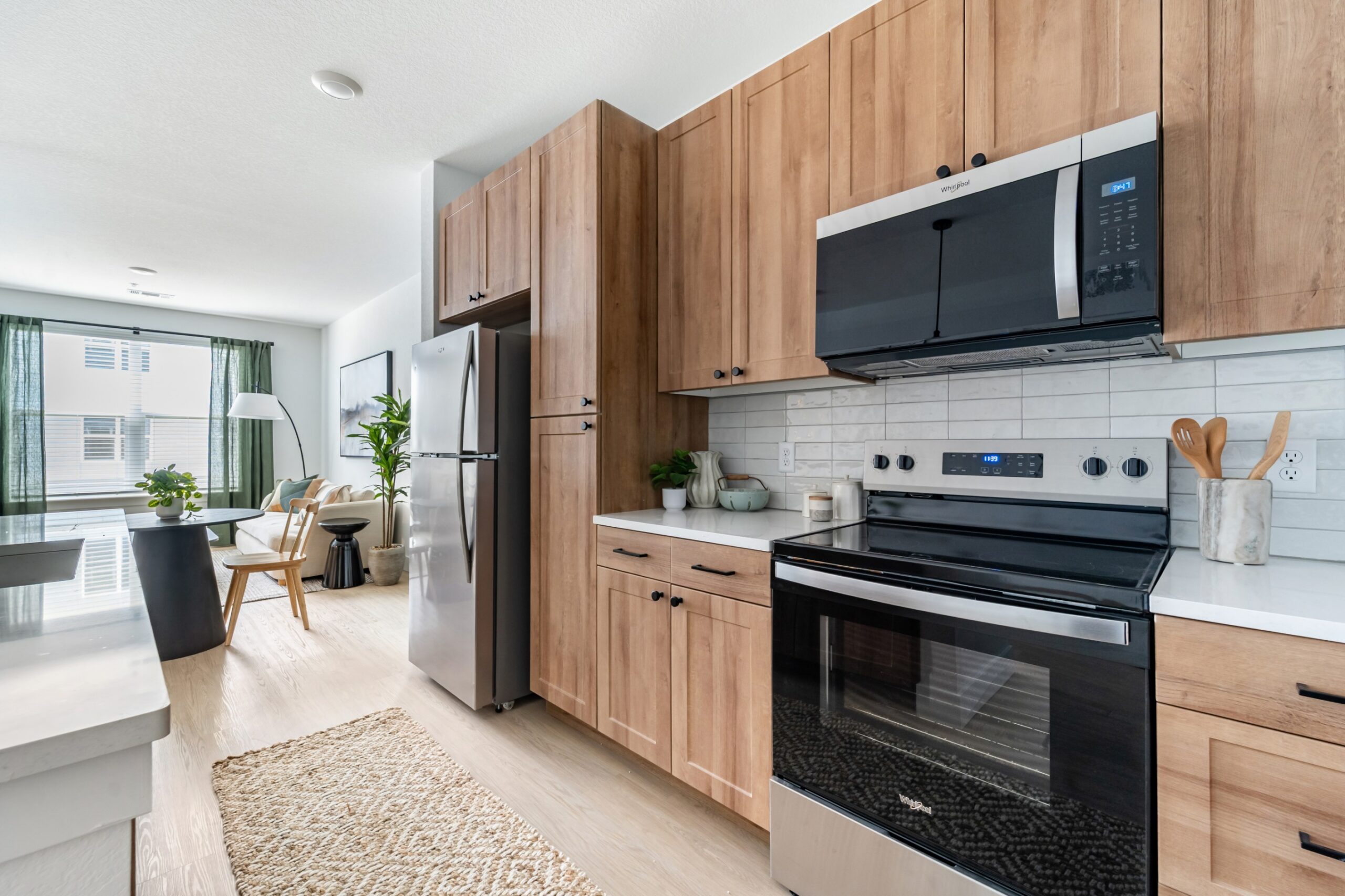 Kitchen with quartz countertops and tile backsplash