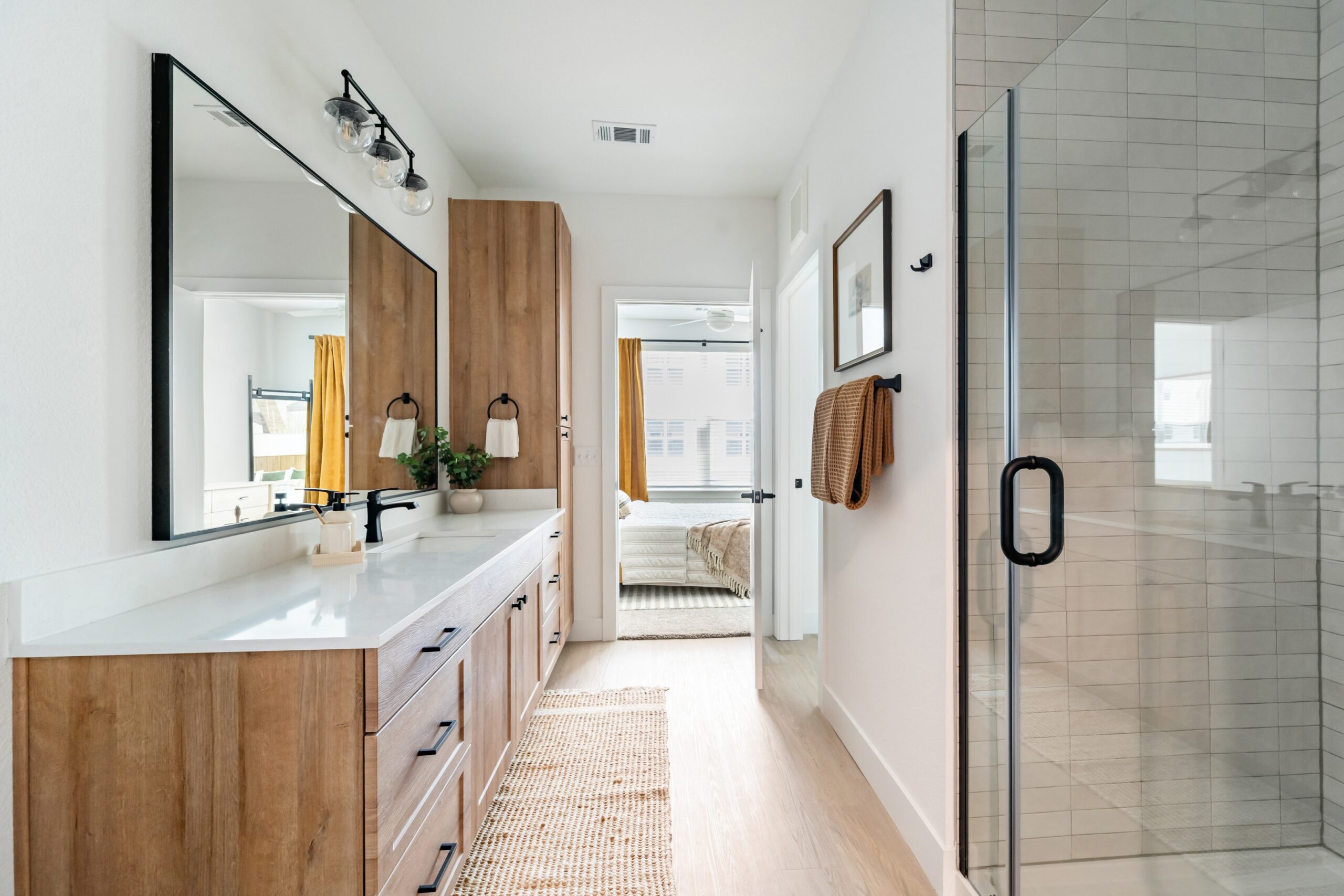 Model bathroom with walk-in glass shower
