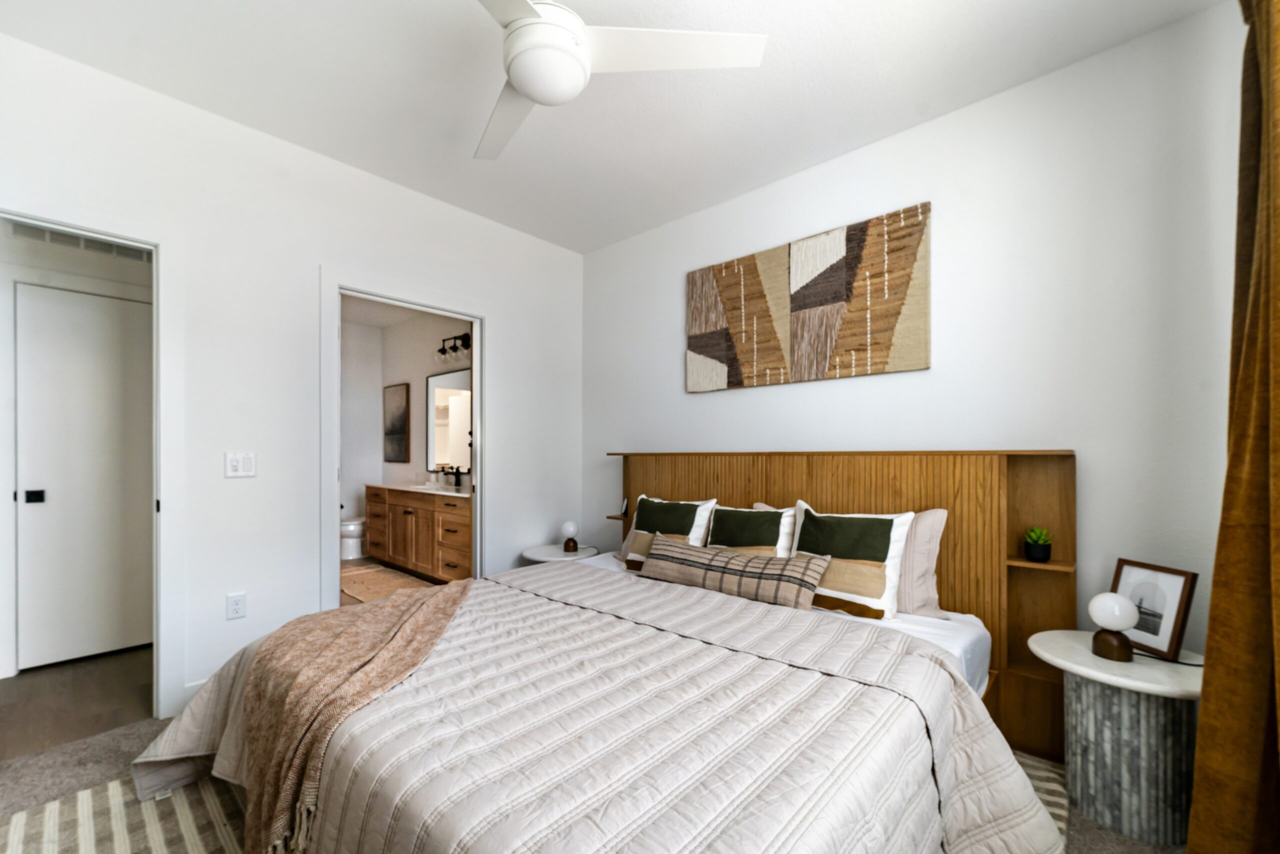 Model primary bedroom with attached bathroom