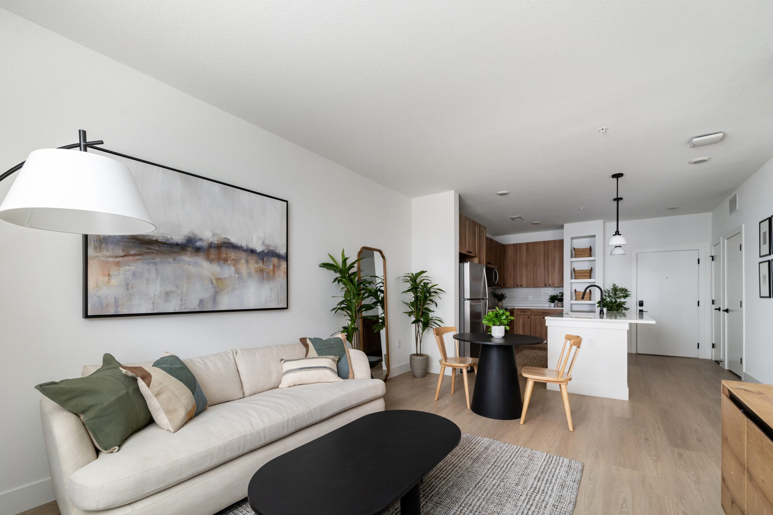 Open kitchen and living room of a model apartment at Banyan High Point